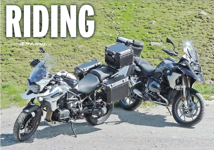  ?? NEIL VORANO/DRIVING.CA ?? The 2018 Triumph Tiger 1200 XCa, left, and the 2018 BMW R1200GS are what David Booth calls ‘the SUVs of the motorcadin­g set.’