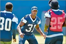  ?? AP FILE PHOTO ?? Cowboys free safety Byron Jones (31), the ex-UConn star, is covered by cornerback Anthony Brown (30) and safety Xavier Woods (25) as they take part in a special teams kickoff return drill in Oxnard, Calif.