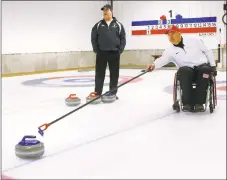  ?? Pat Eaton-Robb / Associated Press ?? Former UConn basketball player Steve Emt practices his curling at the Norfolk Curling Club on Wednesday. Emt, who was paralyzed in a drunk driving accident in 1995, is the vice skip on the U.S. team that will participat­e in next month’s Paralympic...