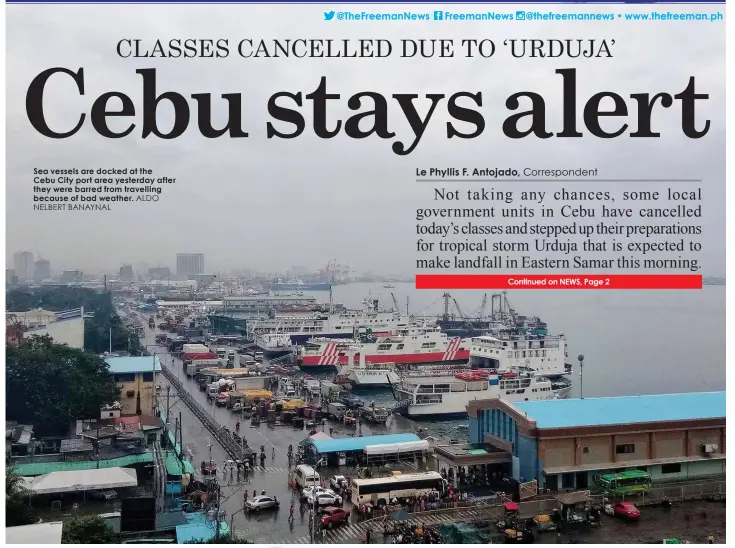  ?? NELBERT BANAYNAL
ALDO ?? Sea vessels are docked at the Cebu City port area yesterday after they were barred from travelling because of bad weather.