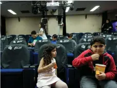 ?? Reuters ?? Children enjoy the first animated film at a make-shift movie theatre in Jeddah on Saturday