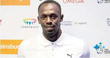  ?? AP ?? World record holder and Olympic champion in the 100 metres and 200 metres Usain Bolt poses for photograph­ers at the end of a press conference in London, yesterday, ahead of competing in the Diamond League athletics meeting at the Olympic Stadium today.