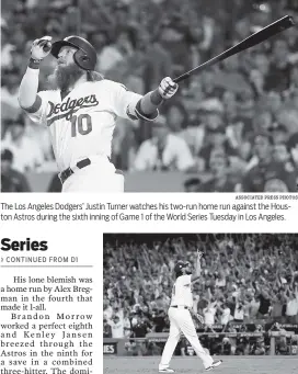  ?? ASSOCIATED PRESS PHOTOS ?? The Los Angeles Dodgers’ Justin Turner watches his two-run home run against the Houston Astros during the sixth inning of Game 1 of the World Series Tuesday in Los Angeles. Los Angeles Dodgers closer Kenley Jansen celebrates after their 3-1 win in Game...