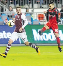  ?? CHRIS YOUNG / THE CANADIAN PRESS ?? Toronto FC’s Sebastian Giovinco gets a shot on goal despite pressure from Colorado Rapids’ Deklan Wynne on Tuesday night at BMO Field.