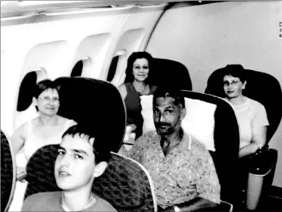  ??  ?? Josie LoBianco, left, Marianne Hurley and Sara Coppa, back row, fly to San Antonio, Tex., on an Air Canada plane on their way home.