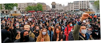  ??  ?? Masked march: Black Lives Matter protesters in Trafalgar Square yesterday