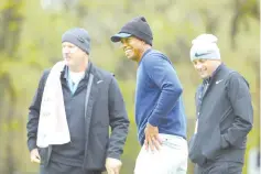  ?? — AFP photo ?? Tiger Woods of the United States and caddie Joe LaCava look on during a practice round prior to the PGA Championsh­ip at Bethpage Black on May 13, 2019 in Bethpage, New York.