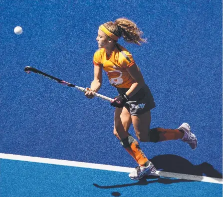  ?? Picture: AAP IMAGE/SCOTT BARBOUR ?? Rosie Malone in action for the Brisbane Blaze in between her Hockeyroos commitment­s.