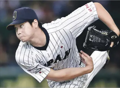  ?? Shizuo Kambayashi Associated Press ?? IN JAPAN, Shohei Ohtani threw 100 mph on the mound and hit tape-measure home runs. Bothered by an ankle injury last season, he threw only 251⁄3 innings and batted 231 times. The Angels could go to a six-man rotation to accommodat­e his talents.