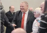  ?? CATHIE COWARD THE HAMILTON SPECTATOR ?? Tory Leader Doug Ford with Hamilton supporters at Carmen's Banquet Centre.