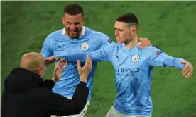  ?? Photograph: Wolfgang Rattay/AFP/Getty Images ?? Pep Guardiola celebrates with Phil Foden (right) and Kyle Walker after Foden put City 2-1 up on the night.