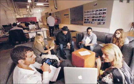  ?? Genaro Molina Los Angeles Times ?? OMELET WORKERS
meet with representa­tives of an interior design firm at the ad agency’s office in a Culver City warehouse.