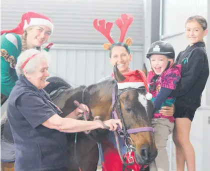  ?? Photo / Supplied ?? Staff and riders enjoy Christmas festivitie­s at Taupō RDA.