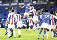  ?? AFP ?? Brighton’s defender Lewis Dunk (centre left) vies with Crystal Palace’s defender Gary Cahill (centre) during the English Premier League football match in Brighton on Monday.