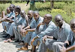  ?? JOSPHAT KASIRE/AP ?? The African Prisons Project helps poor, illiterate inmates learn to read and study the law so they can advocate for themselves in court.