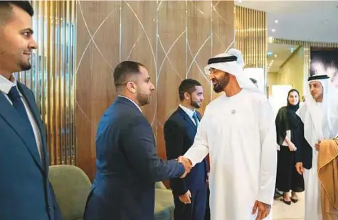  ??  ?? Shaikh Mohammad Bin Zayed and Shaikh Mansour meeting Emiratis studying in Kazakhstan yesterday. WAM