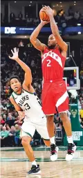  ?? MORRY GASH/ASSOCIATED PRESS ?? Kawhi Leonard of the Toronto Raptos shoots Thursday in front of the Bucks’ Malcolm Brogdon during Game 5 of the NBA Eastern Conference finals in Milwaukee. The Raptors won 105-99 to take a 3-2 series lead.