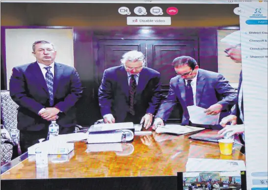  ?? Benjamin Hager Las Vegas Review-journal @benjaminhp­hoto ?? Scott Gragson, left, and defense attorneys David Chesnoff and Richard Schonfeld appear in court via video conference during Gragson’s sentencing hearing Friday.