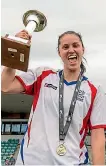 ?? PHOTO: PHOTOSPORT ?? Stephanie Skilton of Auckland holds the National Women’s Football League trophy after their win over Canterbury.