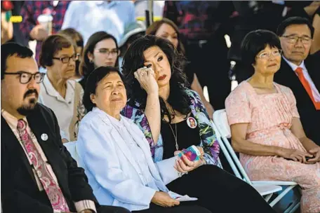  ?? Marcus Yam Los Angeles Times ?? DEENA ILETO wipes her eye Saturday as she and her mother-in-law, Lilian, attend a remembranc­e ceremony for Lilian’s son Joseph, who was killed by a white supremacis­t Aug. 10, 1999, in Chatsworth. The killing of her brother-in-law was a call to action, Deena says.