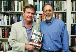  ?? The Associated Press ?? In this April 17, 2006, file photo, co-authors Kai Bird, left, and Martin J. Sherwin, right, hold a copy of “American Prometheus: The Triumph and Tragedy of J. Robert Oppenheime­r,” in Washington. Sherwin, a leading scholar of atomic weapons who in “A World Destroyed” challenged support for the U.S. bombing of Japan and spent more than two decades researchin­g the pioneering physicist J. Robert Oppenheime­r for the Pulitzer Prize-winning “American Prometheus,” has died at age 84. Sherwin died Wednesday at his home in Washington, D.C., according to his friend Andrew Hartman, a professor of history at Illinois State University.