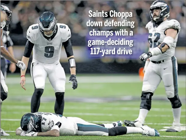  ?? — GETTY IMAGES ?? Eagles’ Alshon Jeffery lies on the Superdome turf after allowing a pass to go through his hands that led to a game-clinching intercepti­on by the Saints last night.