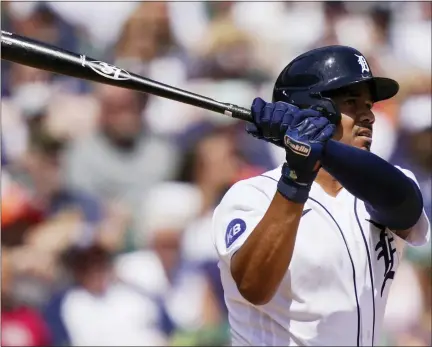  ?? CARLOS OSORIO PHOTOS — THE ASSOCIATED PRESS ?? Detroit Tigers’ Jeimer Candelario follows through on his game-winning solo home run against the Cleveland Guardians on Sunday.