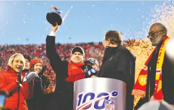  ?? PETER AIKEN/GETTY IMAGES ?? Kansas City Chiefs owner Clark Hunt, seen holding up the Lamar Hunt trophy after his team beat the Tennessee Titans to win the AFC championsh­ip, has realized two of three goals he set out coming into the season.
The final challenge is to hoist the Lombardi Trophy after winning the Super Bowl.