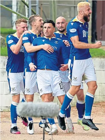  ??  ?? BACK IN FORM: Michael O’Halloran, middle, is swamped by his team-mates after scoring.