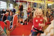  ?? DIGITAL FIRST MEDIA — FILE PHOTO ?? Avalon Walter, 5, from West Lawn enjoyed her ride on the Carousel at Pottstown when it first opened in December, 2016.