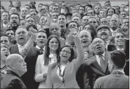  ?? AP/ARIANA CUBILLOS ?? Delcy Rodriguez (center) leads a cheer for an official photo Friday in Caracas after she was chosen as president of Venezuela’s new, all-powerful constituti­onal assembly.