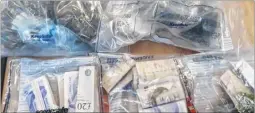  ??  ?? Police seized cash and drugs from a suspected dealer