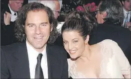  ?? L. Cohen WireImage/Getty Images ?? PRODUCER Andrew Slater and Lisa Marie Presley at 2005 MusiCares Person of the Year dinner. “She was doing music for the right reason,” Slater says.