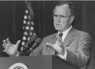  ?? Joe Burbank / TNS ?? George H.W. Bush delivers remarks in Orlando, Fla., on March 13, 1996. Bush was recognized for his restraint as the Iron Curtain was falling and the U.S. was emerging as the sole superpower.