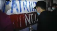  ?? ?? In this still shot from the video, three individual­s can be seen spray painting the Patriot Front logo onto the Boyertown mural.