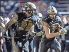  ?? Steven Eckhoff ?? Pepperell’s Payton Rhoades (7) is joined by teammate Levi Lane as he runs into the end zone for a touchdown following a fumble recovery Friday night.