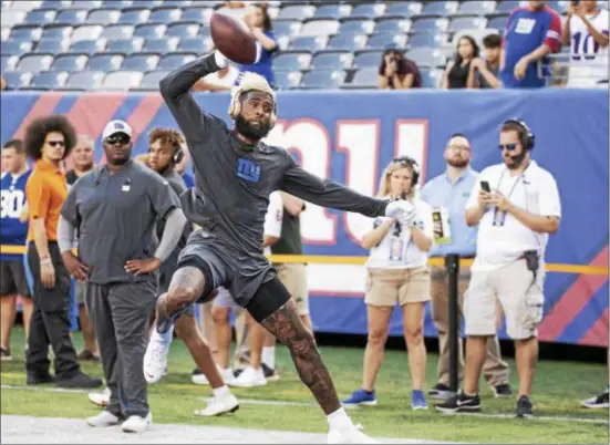  ?? JOHN BLAINE — FOR THE TRENTONIAN ?? Giants receiver Odell Beckham Jr. warms up prior to a preseason game against the Cleveland Browns at MetLife Stadium on Thursday night.