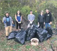  ?? PHOTO PROVIDED ?? Saratoga PLAN’s Next Generation Committee members volunteer to clean up trash at the Saratoga Siege Trail in the Village of Victory.