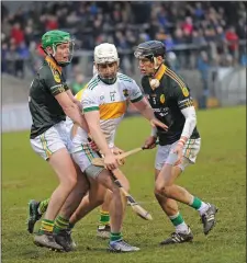  ??  ?? Joe Ryan Cloughduv battles for posession with Blackrock duo Joe Golden and Conor O’Brien in the Intermedia­te Hurling Final at Páirc Ui Rinn Photo by George Hatchell