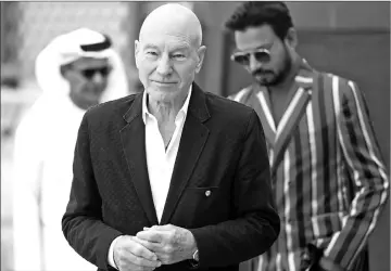  ??  ?? English actor Sir Patrick Stewart arrives for a photo call, followed by Indian actor Sahabzade Irfan Ali Khan known as Irrfan Khan (right) and Abdulhamid Juma Dubai Internatio­nal Film Festival deputy director General, Film & Entertainm­ent Division...