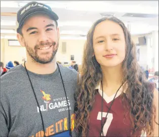  ?? DAVE KEARSEY/SALTWIRE MEDIA/THE WESTERN STAR ?? Shane Morgan, coach of the Team Indigenous female volleyball team, poses with Brianna Wolfrey, one of his players, at the 2018 N.L. Winter Games athletes’ village in Deer Lake.