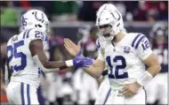  ?? MICHAEL WYKE - THE ASSOCIATED PRESS ?? FILE - In this Sunday, Dec. 9, 2018, file photo, Indianapol­is Colts quarterbac­k Andrew Luck (12) celebrates with running back Marlon Mack (25) after securing a win against the Houston Texans in the second half of an NFL football game in Houston. In his comeback from a 2017 season lost to a shoulder injury, Luck has been sensationa­l, working behind an offensive line that has gone from sieve to sturdy.