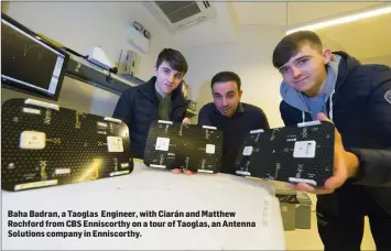  ??  ?? Baha Badran, a Taoglas Engineer, with Ciarán and Matthew Rochford from CBS Enniscorth­y on a tour of Taoglas, an Antenna Solutions company in Enniscorth­y.