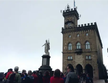  ??  ?? 2 A crowd gathers before the Palazzo del Governo, the official government structure of San Marino