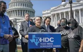  ?? J. Scott Applewhite Associated Press ?? TEXAS STATE Rep. Senfronia Thompson, center, shown last week, and other Democratic lawmakers say the GOP elections bill is an attack on voting rights.