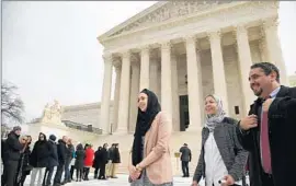  ?? Chip Somodevill­a Getty Images ?? PLANTIFF Samantha Elauf, left, her mother, Majda, and lawyer P. David Lopez leave the Supreme Court after oral arguments in February.