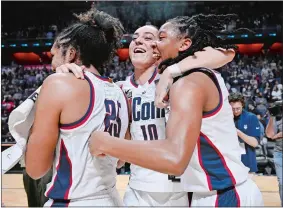  ?? JESSICA HILL/AP PHOTO ?? UConn’s Nika Muhl, center, celebrates with Ice Brady, left, and KK Arnold, right, at the end of Monday’s Big East Conference tournament final at Mohegan Sun Arena.