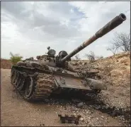  ?? ?? A destroyed tank is seen by the side of the road May 1 south of Humera, in an area of western Tigray then annexed by the Amhara region during the ongoing conflict in Ethiopia.