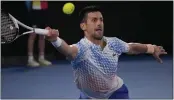  ?? DITA ALANGKARA — THE ASSOCIATED PRESS ?? Novak Djokovic of Serbia plays a return to Stefanos Tsitsipas of Greece during the men's singles final at the Australian Open in Melbourne, Australia, on Sunday.