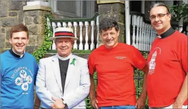  ?? SUBMITTED PHOTO — 21ST WARD FOURTH OF JULY ASSOCIATIO­N ?? Paul Adler, of St. Alban’s; Tim Steeves, of St. Mary’s; Langdon Palmer, of Leveringto­n Presbyteri­an; and Kirk Berlenbach, of St. Timothy’s, prepare for this year’s Independen­ce Day Parade of Churches and Sunday Schools.